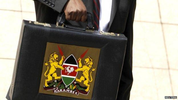 Kenya's finance minister holding up a briefcase containing the budget in Nairobi - June 2013