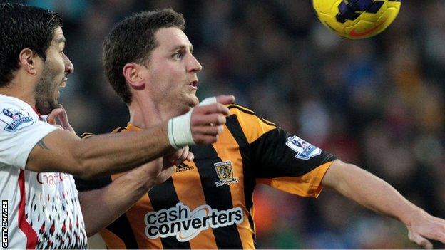 Hull City defender Alex Bruce in action against Liverpool