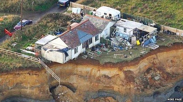 Ms Neirop-Reading's home on the cliff after December tidal surge 2013