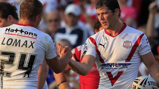 Paul Wellens (r) shakes hands with Jonny Lomax