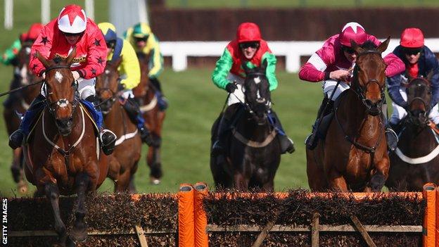 Sam Twiston-Davies riding The New One clears the last fence on his way to victory in the Novices' Hurdle Race during Ladies Day at Cheltenham Racecourse on March 13, 2013.