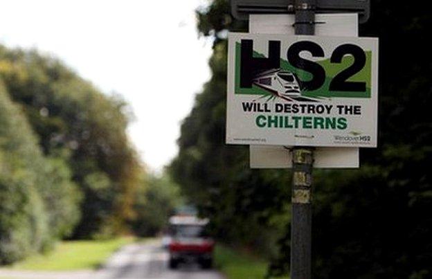 Sign on side of country road says "HS2 will destroy the Chilterns"