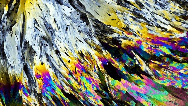Benzamidine crystals. Benzamidine is an aromatic compound used as a ligand in protein crystallography
