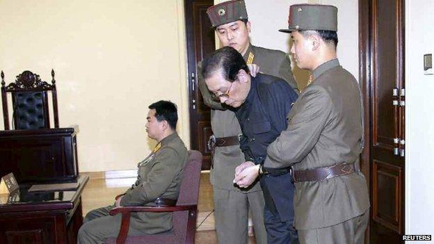 Jang Song Thaek, with his hands tied with a rope, is dragged into the court by uniformed personnel December 12, 2013 in this picture published in Rodong Sinmun December 13, 2013 and released by Yonhap