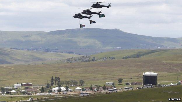 South African military helicopters staged a fly-past as Mr Mandela's coffin was interred