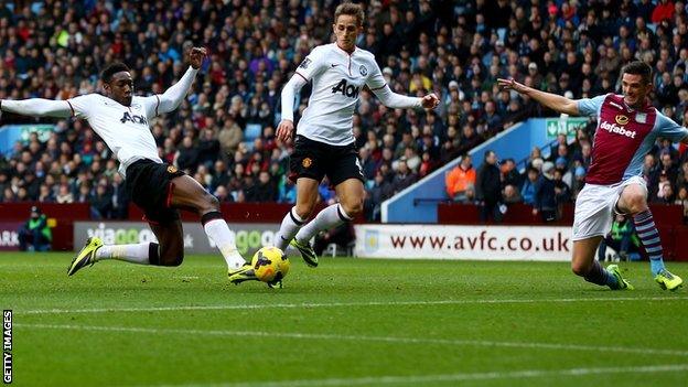 Manchester United striker Danny Welbeck (left) scores his side's second against Aston Villa