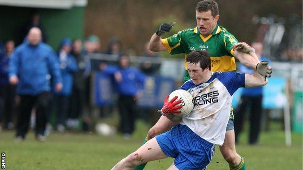 Ballinderry's Gareth McKinless is challenged by Kevin Waldron of Kingdom Kerry Gaels