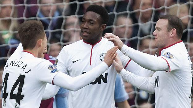 Manchester United's Danny Welbeck (centre) is congratulated by Adnan Janujaz (left) and Wayne Rooney after scoring against Aston Villa