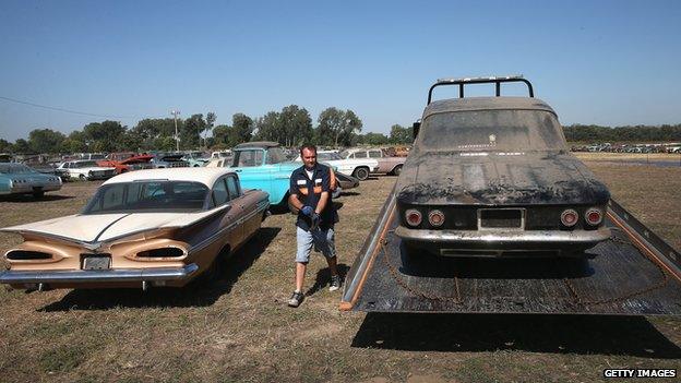 A Chevrolet Corvair is unloaded in Nebraska