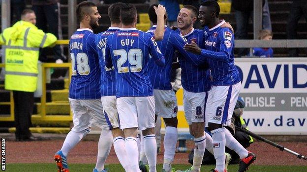Carlisle players celebrate