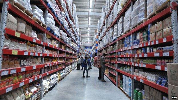 Shoppers browse through the products of a newly opened Bharti Wal-Mart Best Price Modern wholesale store in India