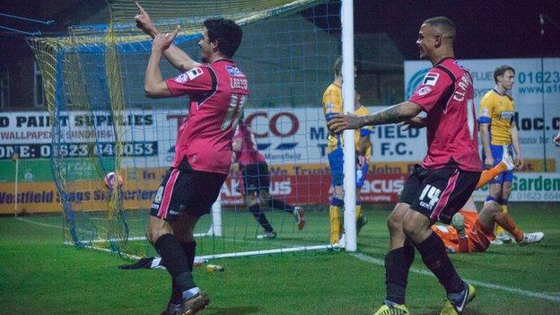 Matteo Lanzoni (left) celebrates scoring Oldham's third goal