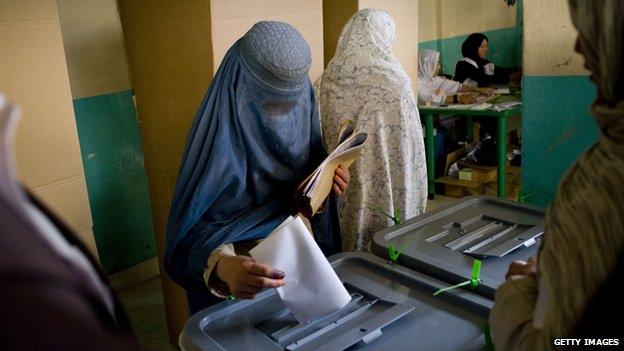 An Afghan woman casts her vote inside a polling centre in Kabul in August 2009