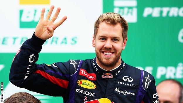 Sebastian Vettel celebrates his fourth World Championship after victory at the Brazilian Grand Prix.