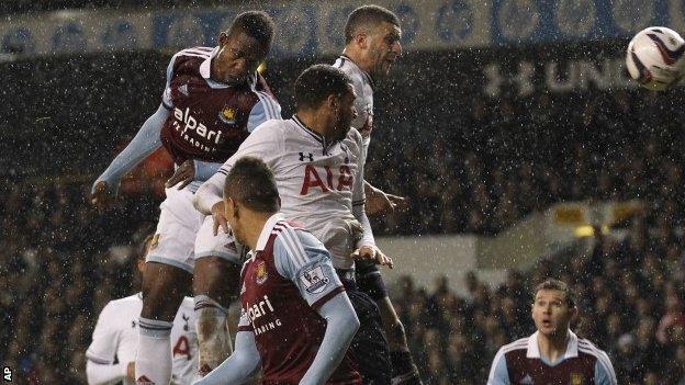 West Ham 's Modibo Maiga, top left, scores against Tottenham Hotspur during the League Cup