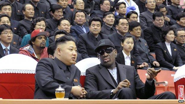 North Korean leader Kim Jong-un (front left) and former NBA star Dennis Rodman (front right) speaking at a basketball game in Pyongyang, 28 February 2013