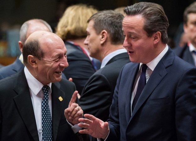 UK Prime Minister David Cameron (right) talking to Romanian President Traian Basescu in Brussels, 20 December