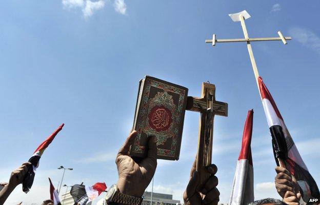 Protesters hold crosses and Koran in demonstrations against sectarianism in Cairo, 2011