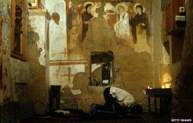 Muslim man prays in Monastery of St. Moses the Abyssinian, east of Nebek, Syria