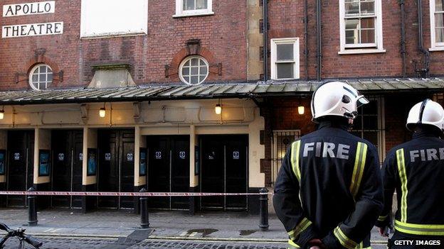 Firefighters stood outside the Apollo