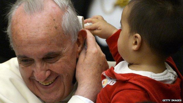 Pope Francis and a child