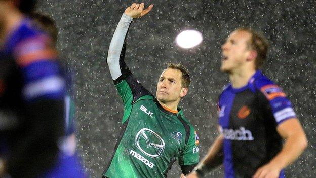 Dan Parks (centre) celebrates after landing Connacht's late winning drop goal as snow falls in Galway