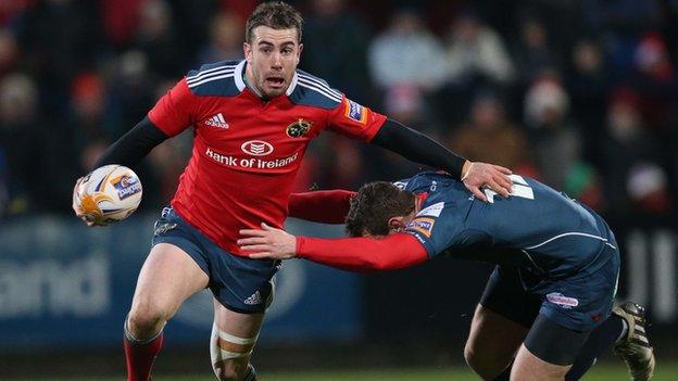 Munster fly-half JJ Hanrahan tries to get past Adam Warren at Musgrave Park