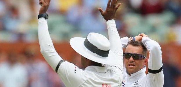 England spinner Graeme Swann looks dejected as Australia hit him for six