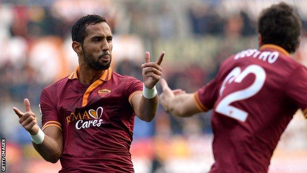 Roma's Mehdi Benatia celebrates scoring against Catania