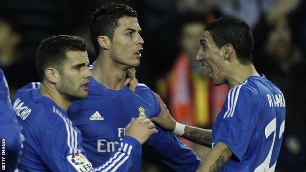 Cristiano Ronaldo is congratulated by Real Madrid team-mates