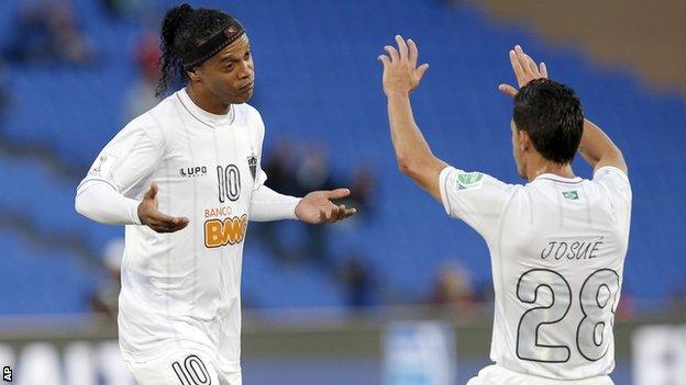 Atletico Mineiro's Ronaldinho (left) celebrates with Josue after scoring against Guangzhou Evergrande in the Club World Cup soccer tournament in Marrakech, Morocco