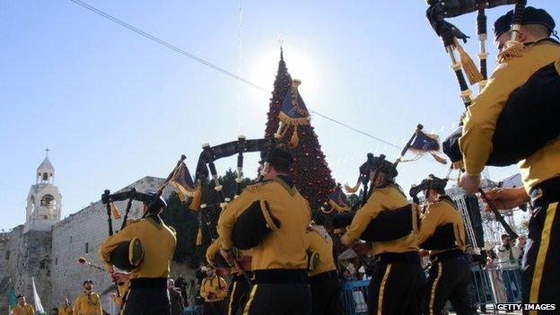 Palestinian Christian scouts perform at Manger Square outside the Church of the Nativity