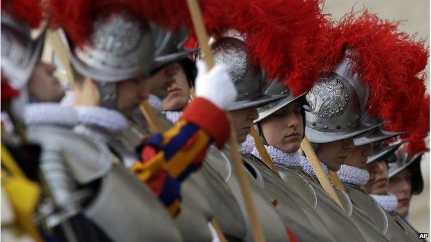 Swiss guards get ready prior to the start of Pope Francis Urbi et Orb message December 25