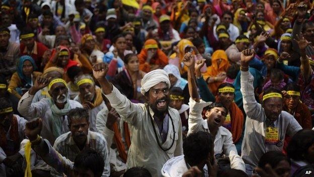 Indian Dalits, or untouchables, shout slogans demanding equal growth opportunities in Delhi, India, Friday, Dec 6, 2013