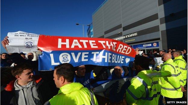 Fans protesting with banners outside Cardiff City Stadium