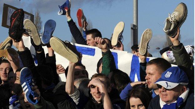 Some Cardiff fans held up shoes as part of the protest