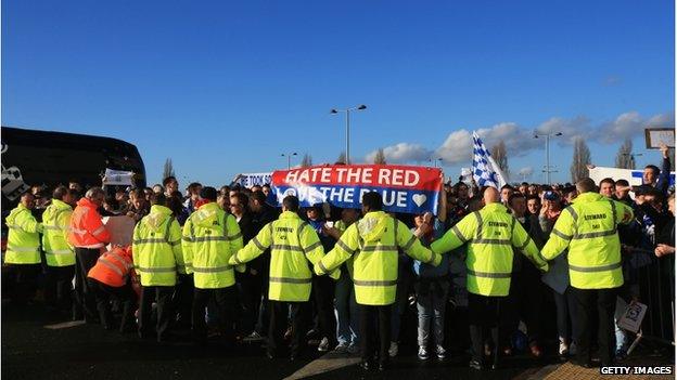 Stewards joined hands to keep the protesters at Cardiff City FC back