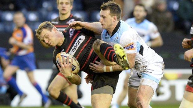 Edinburgh's Greig Tonks is tackled by Stuart Hogg