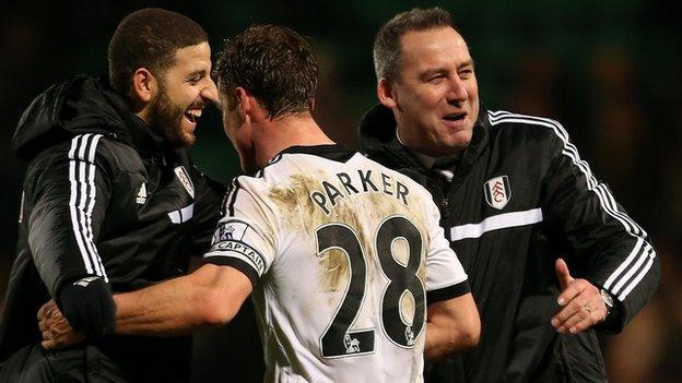 Fulham goalscorer Scott Parker celebrates with Adel Taarabt and Rene Meulensteen