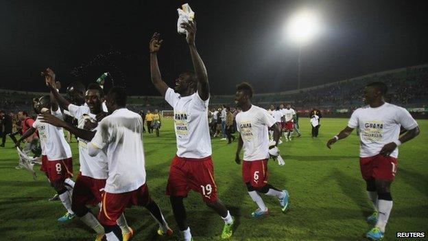 Ghana"s soccer team celebrates winning their 2014 World Cup qualifying second leg playoff soccer match against Egypt at Air Defence "30 June" stadium in Cairo, November 19, 2013.