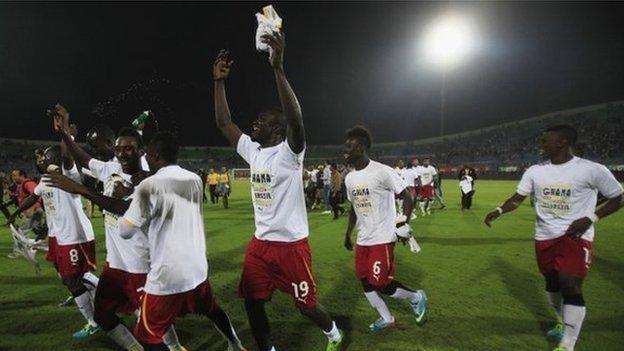 Ghana"s soccer team celebrates winning their 2014 World Cup qualifying second leg playoff soccer match against Egypt at Air Defence "30 June" stadium in Cairo, November 19, 2013.