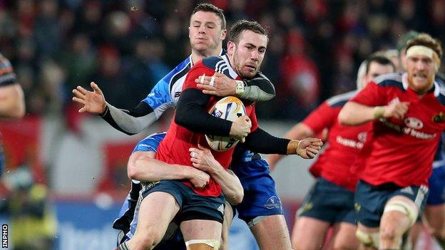 JJ Hanrahan is tackled by Eoin Griffin as Robbie Henshaw lurks in the background