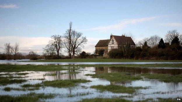 Floodwater surrounds Odda's Chapel in Deerhurst,