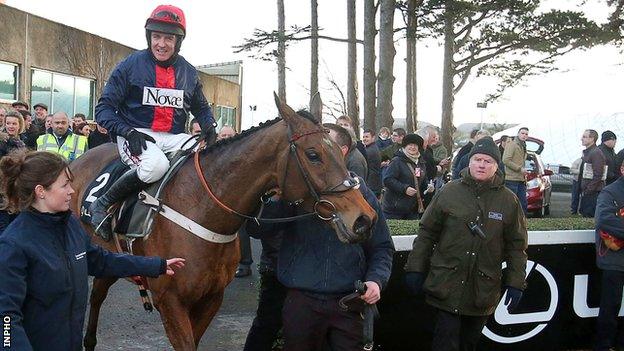 Barry Geraghty on board Bobs Worth is led into the parade ring after winning The Lexus Steeplechase