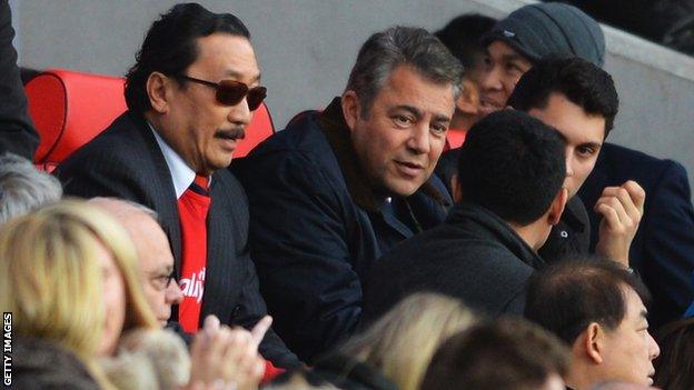 Cardiff City owner Vincent Tan (L) and chairman Mehmet Dalman (C)