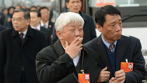 Delegates arrive for the election of the new president of China during the 12th National People's Congress (NPC) in the Great Hall of the People in Beijing on 14 March 2013