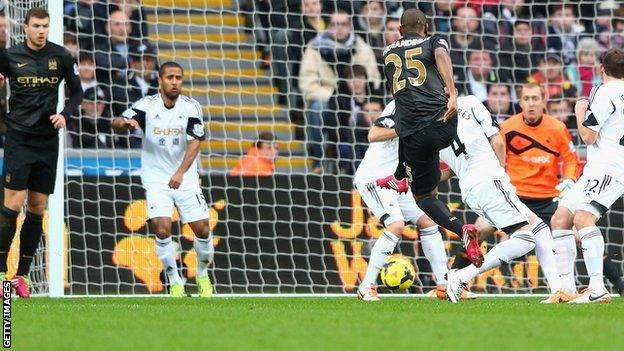 Fernandinho low strike puts Manchester City ahead against Swansea City.