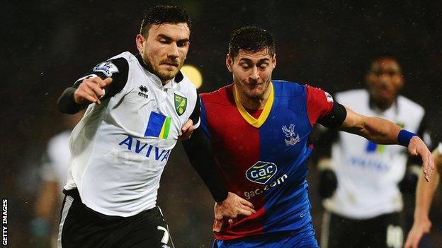 Norwich midfielder Robert Snodgrass battles with Crystal Palace defender Joel Ward