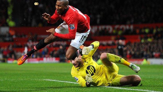 Manchester United's Ashley Young in collision with Tottenham goalkeeper Hugo Lloris