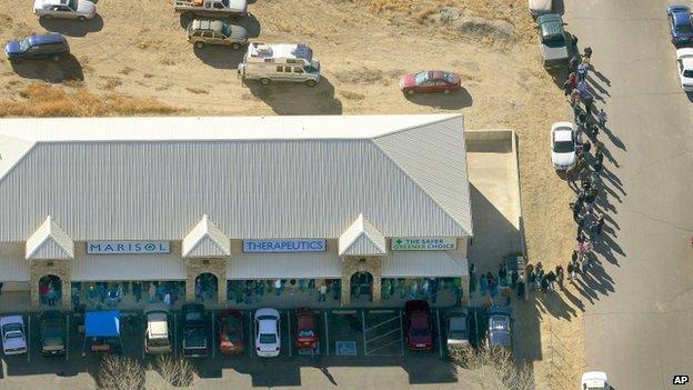 A long line of buyers trails from a store selling marijuana in Pueblo West, Colorado 1 January 2014